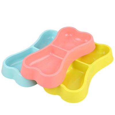 China Sustainable Wholesale Portable Pet Food Bone Shaped Double Feeder Dog Bowl Plastic for sale