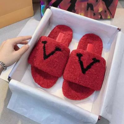 China Ladies fluffy fuzzy luxury designer fashion trend insoles famous brand shoes fluffy plush lamb fur indoor slipper for women for sale