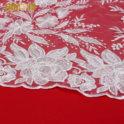 China Other Floral Design White Sequin Sheer Material Fabric By The Yard Embroidery Tulle Lace Fabric For Wedding Dresses for sale