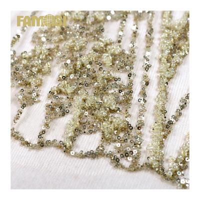 China 2022 High Quality African Gold Sugar Glitter Lace Fabric With Sequin And Beaded Embroidery Fabric For Wedding Dress for sale