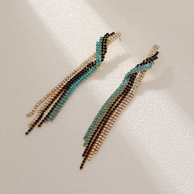 China Hyacinth Light Luxury Style Steel Long Trendy Colorful Stunning Needle Zircon Tassel Instant Irregular Earrings for sale