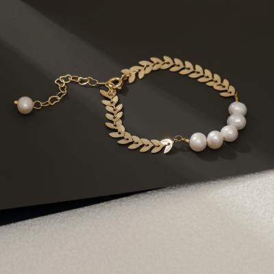 China Graceful Freshwater Pearl Hyacinth Trendy Exquisite Golden Wheat Romantic Leaf Ear Cuff Bracelet for sale