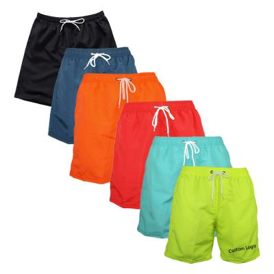 China Customized QUICK DRY Solid Logo Beach Surf Swim Shorts Mens Swim Trunks Mesh Lining Quick Dry Polyester For Men for sale