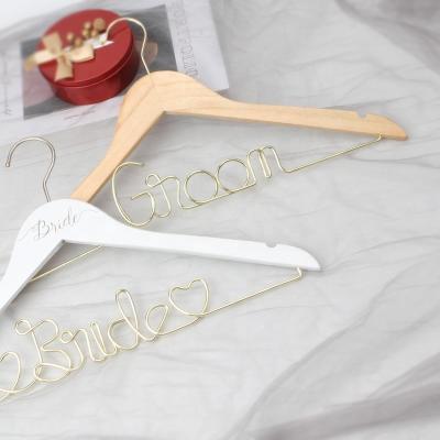 China Behind The Doors/On Walls YS1224B Wholesale Clothing Store Classic Retro Wardrobe Hanger Customized Letter Iron Wire Wood Metal To Clothes Hanger for sale