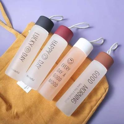 China Low Price 400ml Sustainable Outdoor Colorful Smile Gradient Holy Creative Frosted Glass Water Bottle for sale