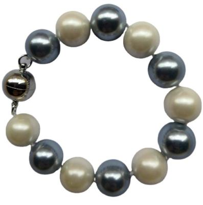 China Fashionable Wholesale Natural Round Pearl 14mm Round Pearl Knotted Bracelet With Magnet For Women for sale