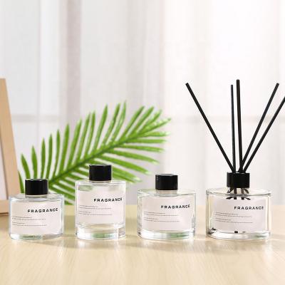 China Decorative Classic Perfume 50ml 100ml 150ml 200ml Matte Black White Round Shape Clear Reed Diffuse Glass Bottle With Cap for sale