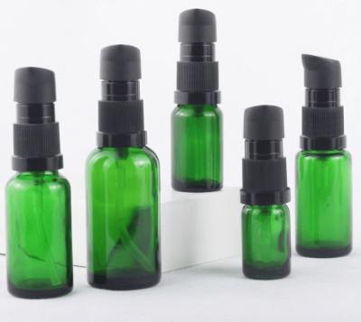 China Amber 4oz 2oz Green Glass Mist Spray Bottles 2 Oz Boston Round Spray Bottle With Fine Mist Sprayer for sale