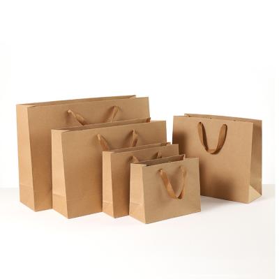 China Handmade Wholesale Custom Logo Craft Kraft Paper Shopping Paper Bag Brown White Black Gift for sale