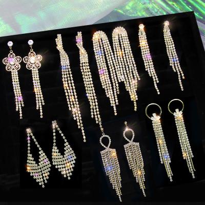 China New style long chain tassel rhinestone luster gold dangling crystal tassel earrings FASHIONABLE pendant earrings for sale