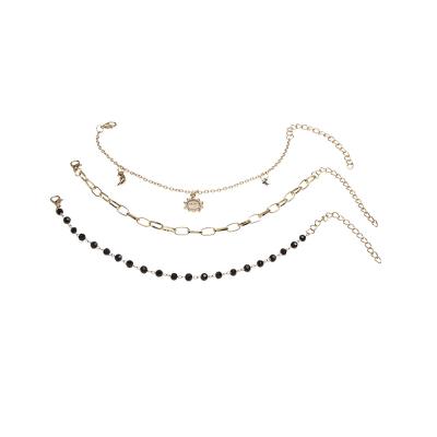 China Fashion TRENDY Hot Selling Multilayer Anklet Set Sun Moon Star Pendant Anklet Set Black Beaded Three-Layer Foot Ornament Set for sale