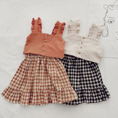 China Girls Casual Suspenders Solid Color Short Top Plus Plaid Skirt Two Piece Set Wholesale for sale