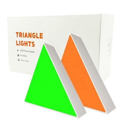 China Modern Dimming Modular Wifi Music Control Smar RGB Triangle Touch Light Splicing Magic Colorful Led Panel Night Lights for sale