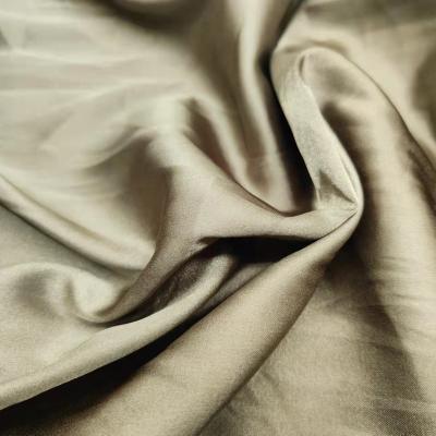 China Hot Selling Spandex Satin Fabric 50*75D Shiny Silky Soft Fabric For Sleepwear Dress for sale