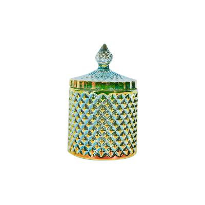 China Essential oil ; Environmental Wholesale New Style Beautiful Multicolor Glass Candle Jar With Decorative Pattern Plated Blue Gold Glass Candle Holders for sale