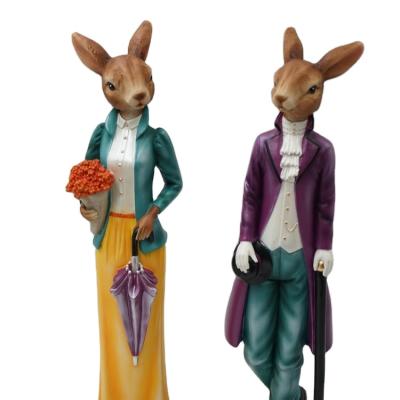 China Retro Fashion Polyresin Yard Men and Rabbits Traditional Lady Rabbits Easter Figurine for Home Decoration for sale