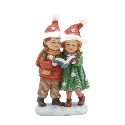 China Classic Christmas style Christmas home decor/Christmas gift boy&girl figurine resin statues European kids ornament in green&red for table home decoration for sale