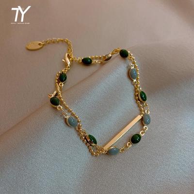 China Retro TRENDY French Metal Gold Color Romantic Double Bangle For Party Uncommon Oval Green Crystal Bangle Woman Fashion Jewelry 2022 for sale