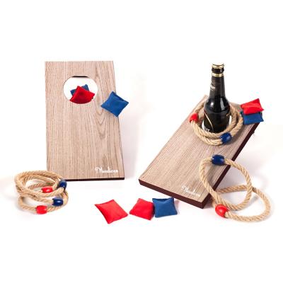 China Patriotic Wooden Bean Bag 2 Fun Party Game/Family Fun Bottle Rope Game Corn Hole in 1 Bag Ring Toss Game for sale