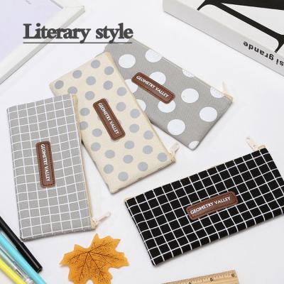 China Schools & Creative desks and student pencil case large capacity single color dot lattice stationery bag for sale