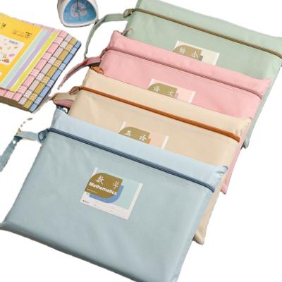 China Canvas Subject Matching A4 Folder Kids Book Homework Reactive Paper Storage Bag Material Portable Canvas Bag for sale