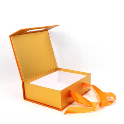 China Recycled Materials Luxury Rigid Packaging Box Golden Paper with Silk Ribbon Flannel Surface Durable for sale