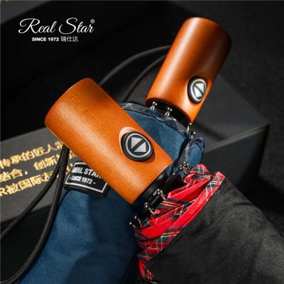 China Morden RST Luxury Real Star 23 Inch Tall Size 10 Ribs High Quality Wood Handle Open And Narrow 3 Fold Automatic Umbrella for sale