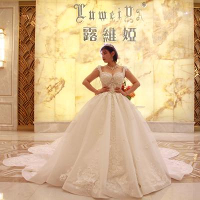 China Anti-Static Imported Lace Pattern Ultra Luxury Wedding Dress Plus Size With Handmade Beadings And Crystals for sale