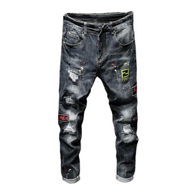 China New Breathable Men's Trend Hole Embroidery Jeans Male Spray Paint Customized Printing Pattern Beggar Pants Trousers for sale