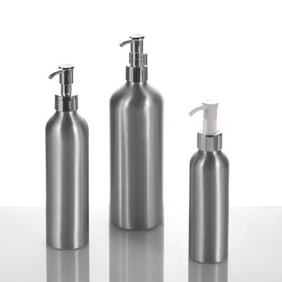 China Personal Care 200ml 300ml 500ml Aluminum Cosmetic Oil Bottle With Silver Oil Pump à venda