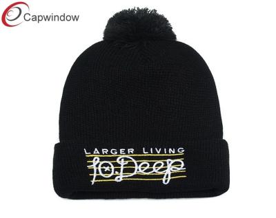 China Knitted Skiing Beanie Winter Hats Flat Embroidery Logo With Pompon On Top for sale