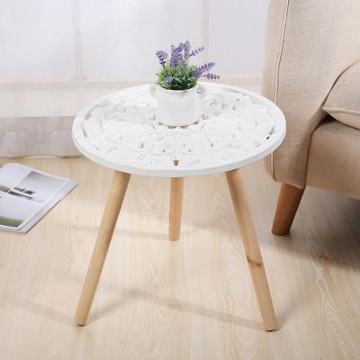 China Hot Selling Wooden Multifunctional Extendable Hollow Out Vintage Patterns White Coffee Table Round Coffee Table New Design for sale