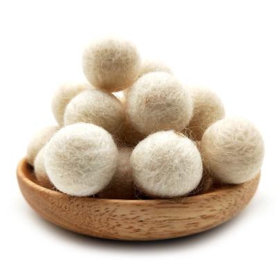 China 6 Pack Wholesale Laundry Deodorization Eco Friendly Wool Balls Wool Cleaning Dryer With Cotton Bag Black White Dark Customized for sale