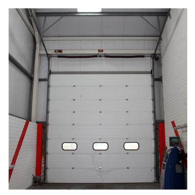 China Doorhan industrial style automatic vertical sliding garage door warehouse sectional door with pedestrian gate for sale