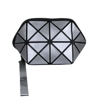 China Waterproof Shell Makeup Bag Geometric Small Fashionable Ladies Cosmetic Bag for sale