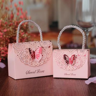 China Hot Sale Customized Materials Logo Cutout Butterfly Wedding Candy Box Recycled Chocolate Party Favor Bag Baby Shower Gift Packaging Box With Handle for sale