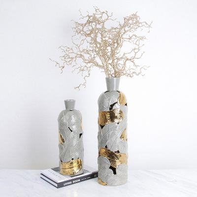 China Leaf Pattern & Nordic Style Bottle Shape Hotel Art Ceramic Small Mouth Gray Gold Leaf Pierced Vase For Home Decor for sale