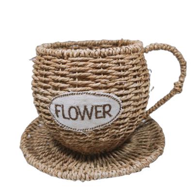 China Durable Handmade Woven Tea Cup Storage Basket Straw Weave Flower Pot Living Room Decoration Arrangement Flower Basket With Handle for sale