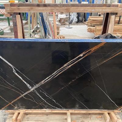 China Modern black absolute aziza conglomerate for tiles sahara gold marquina veined black marble sahara tile black marble kitchen for sale