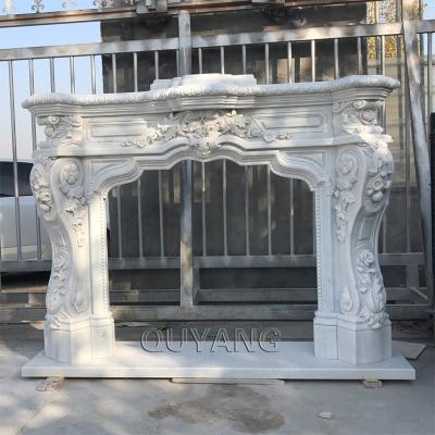 China QUYANG Style Modern Indoor Decorative European Hand - Carved Marble Stone Freestanding Fireplace Mantel Home Fireplace for sale