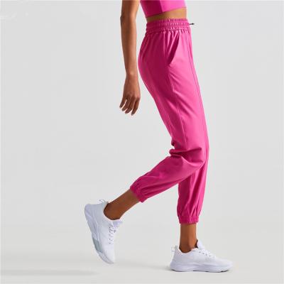 China Drawstring Waist Pocket Women Pants Sports Leisure Yoga Bottoms Loose Joggers Fitness GYM Breathable Bilateral Running Pants for sale