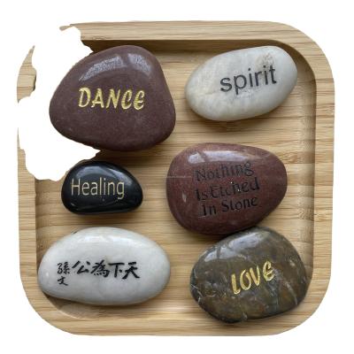 China Modern Black Letter Pebbles River Engraved Natural Stones Smooth Polished Colorful Stone for sale