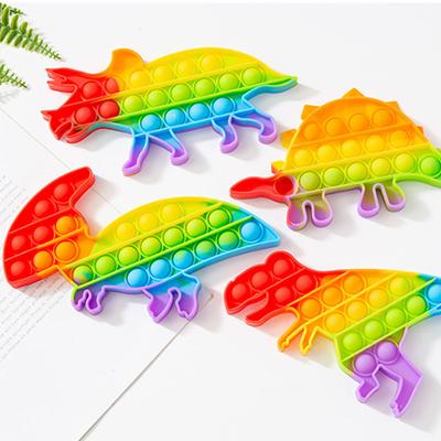 China Dinosaur Rainbow Dinosaur Noise Push Bubbles Sensory Toy Moveable Person for sale