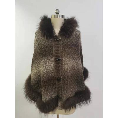 China Anti-wrinkle winter fall cold weather women's polyester shawl cape raccoon fur collar woolen shawls for girls for sale