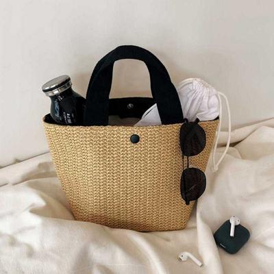 China Fashoion Sweet Temperament Portable Fashion Simple Straw Woven Bucket Designer Handbags 2021 New for sale