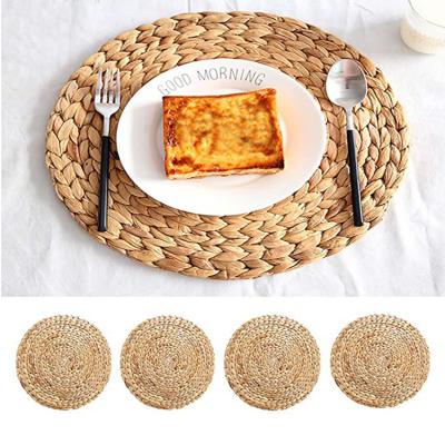 China Sustainable Woven Place Mats Round Corn Husk Weave Place Mat Braided Rattan Placemats for sale