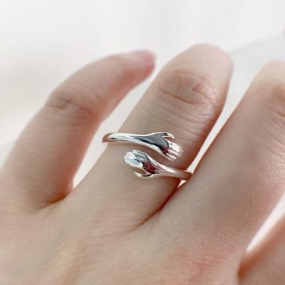 China Romantic Opening Women's Stainless Steel Sterling Silver Couple Love Ring Embrace Ring for sale