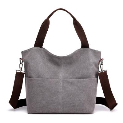 China Canvas Women's Fabric Bag Leisure Swapping Solid Color Messenger Canvas Women's Bag Design Woman Handbag for sale