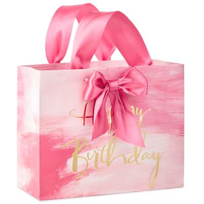 China Recyclable Personalized Clothing Cosmetic Packaging Pink Wedding Paper Bag Happy Birthday Gift Bag With Ribbon Handle for sale