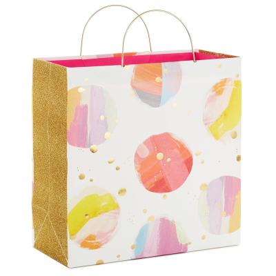 China Recyclable Custom Size Lollipop Pattern Shiny Metal Handle Coated Paper Bag Gift Packaging Bags for sale